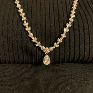 Silver necklace covered in stones